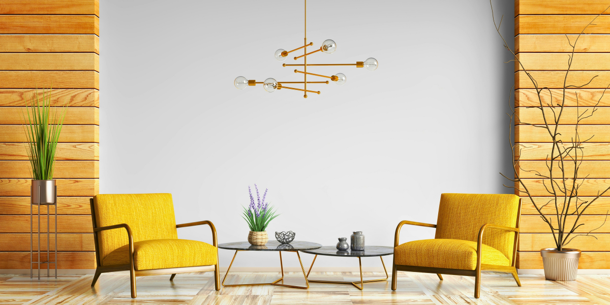 Two empty yellow armchairs facing each other in a bright, modern room.